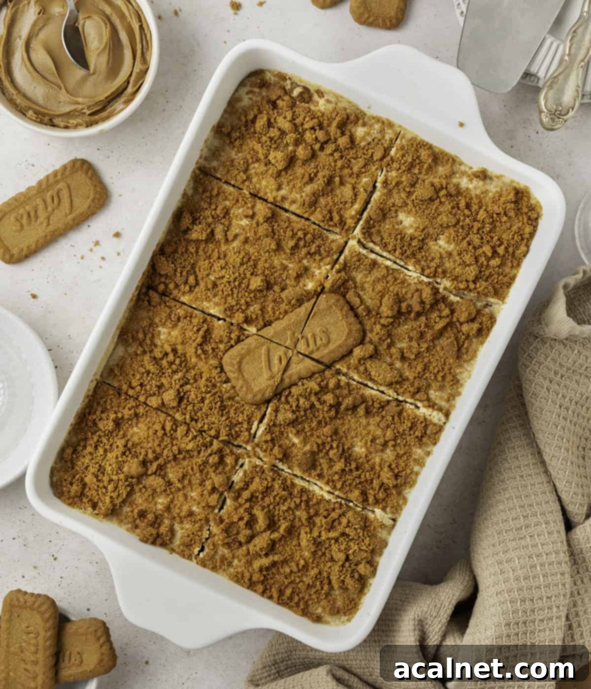 Finished tiramisu with portions cut out seen from above, showcasing the layers.