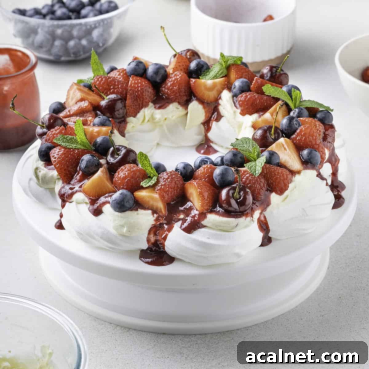 Pavlova Wreath over a white cake stand.