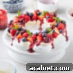 Pavlova Wreath over a white cake stand.