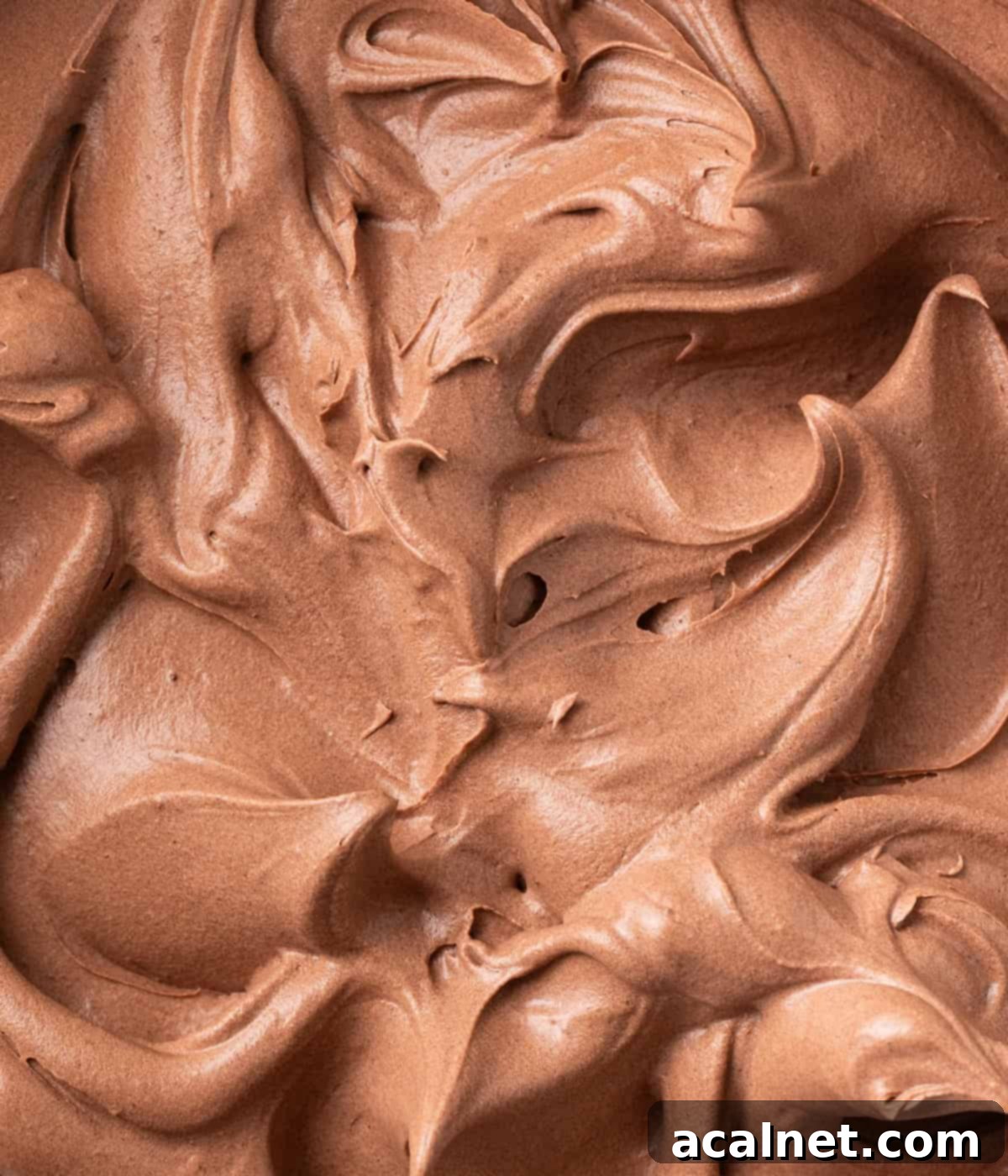 Chocolate Cloud Frosting 5 Macro shot of whipped cream swirls in a bowl, seen from above