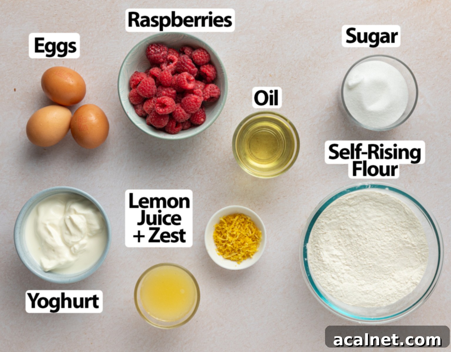 Zesty Lemon Raspberry Loaf 3 Ingredients laid over a beige surface.