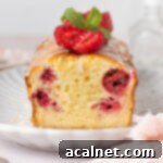 Zesty Lemon Raspberry Loaf 10 Close up on cake crumb showing the baked raspberries inside the lemon cake.