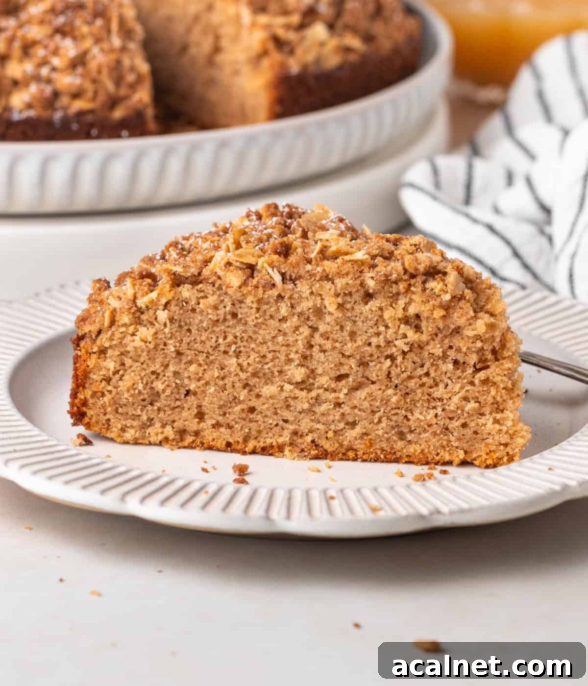 Slice of cake on a small white plate.