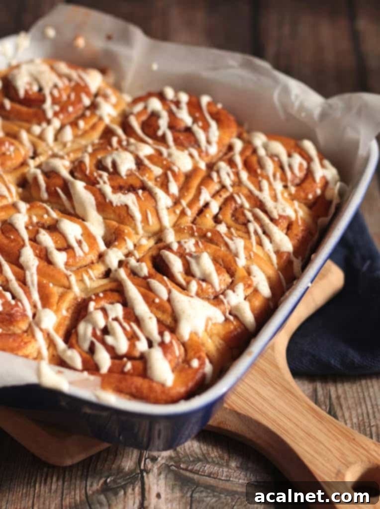 Side view on the breads in the baking dish with the icing drizzle