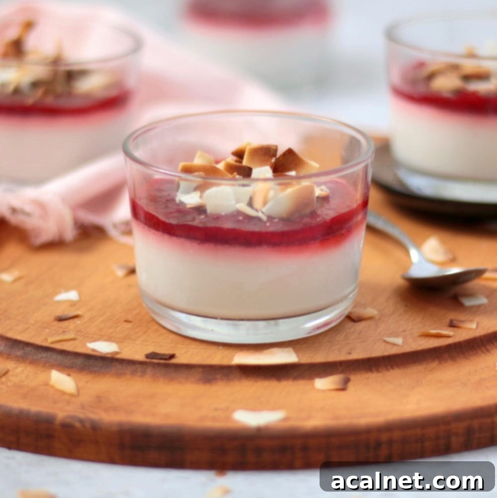 Silken Vegan Coconut Panna Cotta with Sweet Strawberries 2 Close up on the Panna Cotta in a glass cup on a wooden board