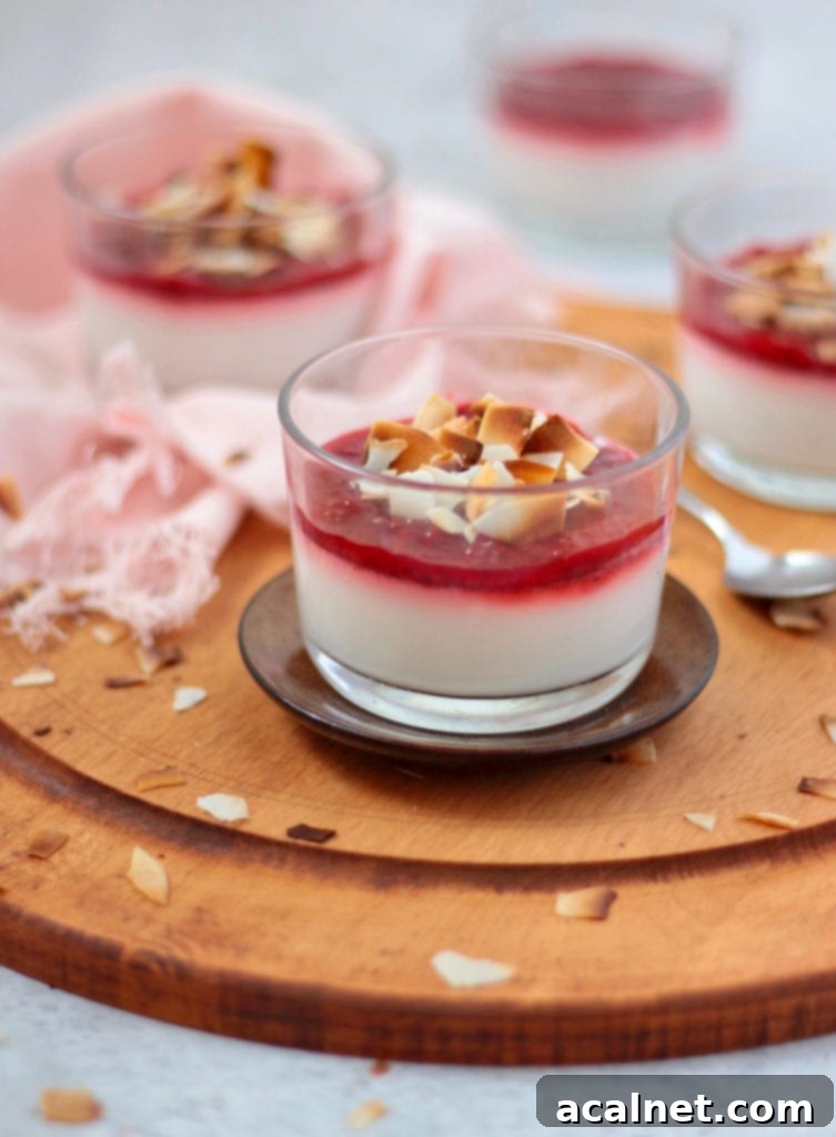 Silken Vegan Coconut Panna Cotta with Sweet Strawberries 3 One panna cotta over a small brown plate and a wooden board