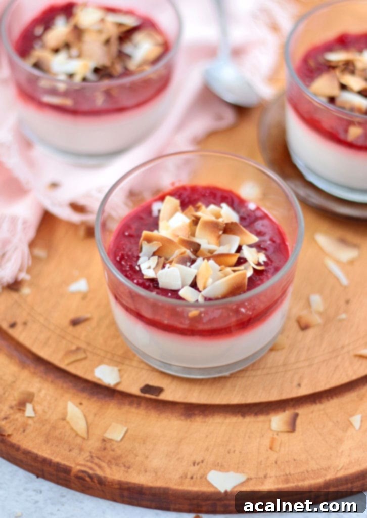Silken Vegan Coconut Panna Cotta with Sweet Strawberries 6 3 dessert cups over a round wooden board.