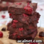 Stack of Raspberry Brownies, indicating the deliciousness of the fudgy chocolate raspberry brownies recipe.