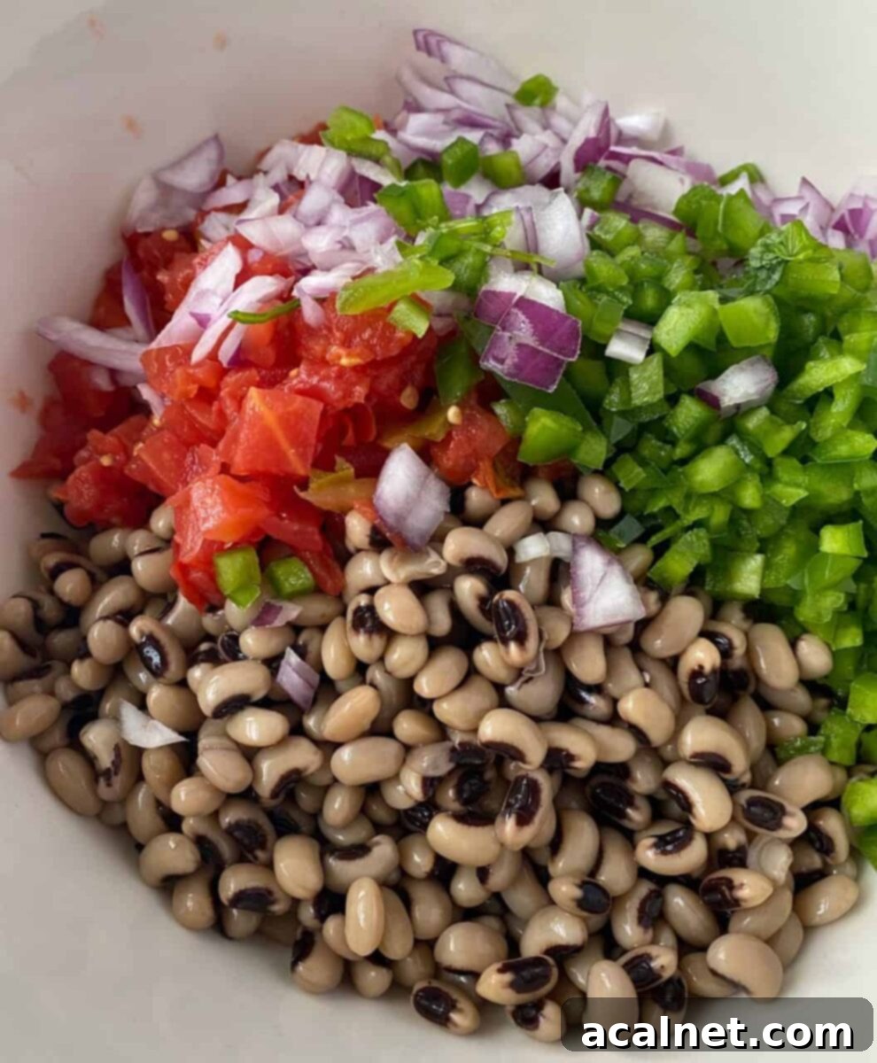 All the colorful salad ingredients in a bowl, not yet mixed, showcasing their freshness and potential.