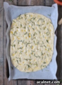 Effortless Rosemary Focaccia Perfection 8 Uncooked Focaccia Bread, ready to go in the oven