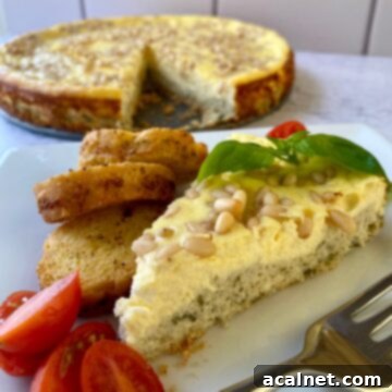 Slice of savory cheesecake with cherry tomato slices, small bread slices and a fork on the side. Whole cheesecake in the background.