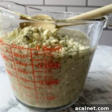 Blue cheese crumbles on top of blended ingredients.