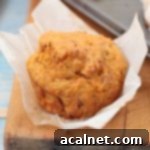 One cake unwrapped over a wooden board