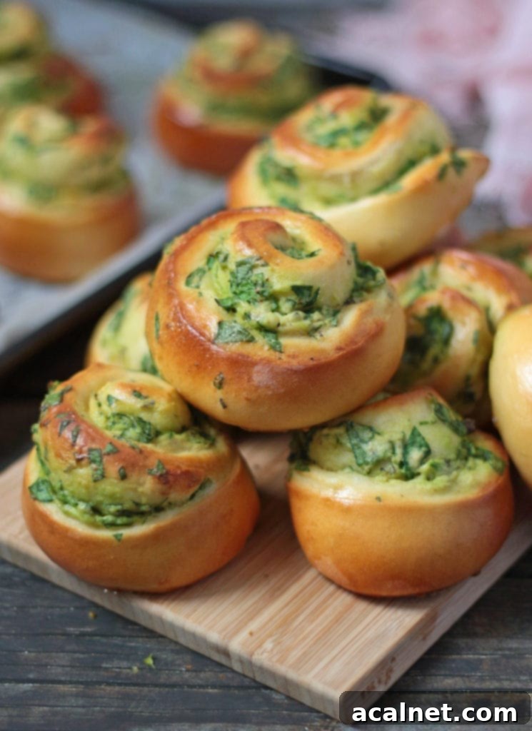 Stack of freshly baked Savoury Rolls with spinach and ricotta filling