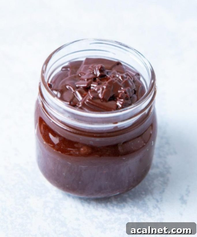 Ultimate Sweet Pancake Topping Guide 15 Thick, glossy chocolate fudge sauce in a glass jar.