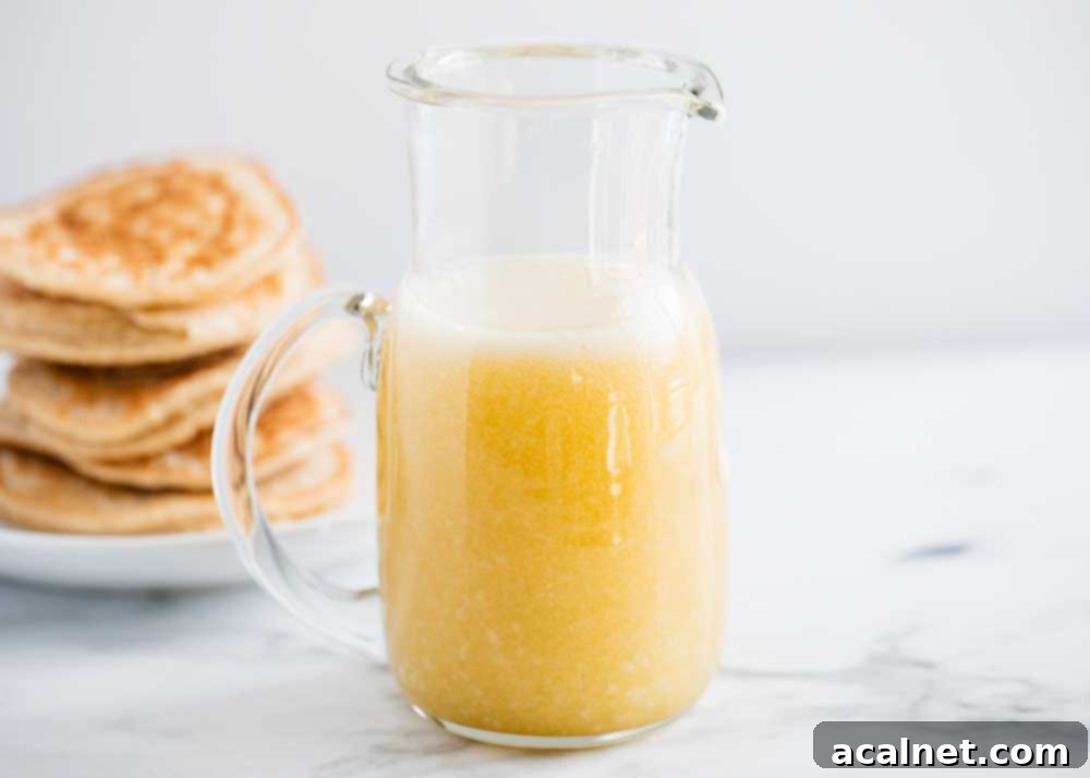 Ultimate Sweet Pancake Topping Guide 18 Buttermilk syrup being poured from a jug onto a plate.