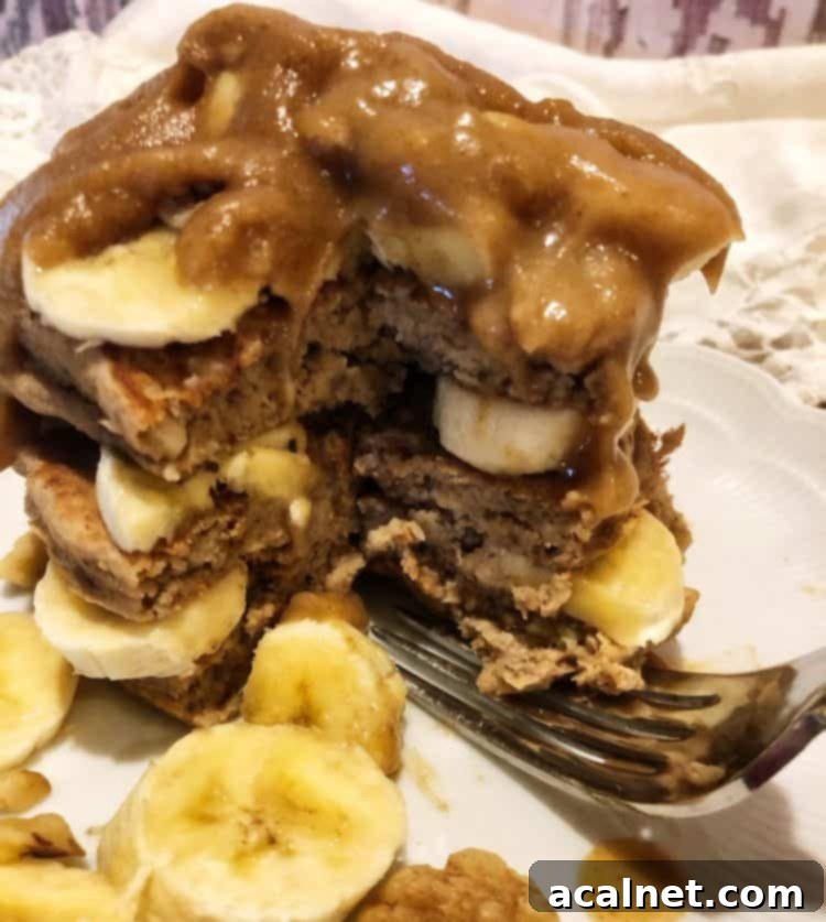 Ultimate Sweet Pancake Topping Guide 23 Coconut date syrup in a glass jar, highlighting its rich, natural color.