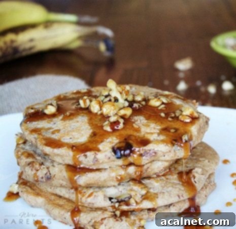 Ultimate Sweet Pancake Topping Guide 31 Caramelized walnuts, glistening with syrup, in a pile.