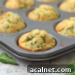 Close up on a Cheddar and Spinach Muffin in the muffin pan