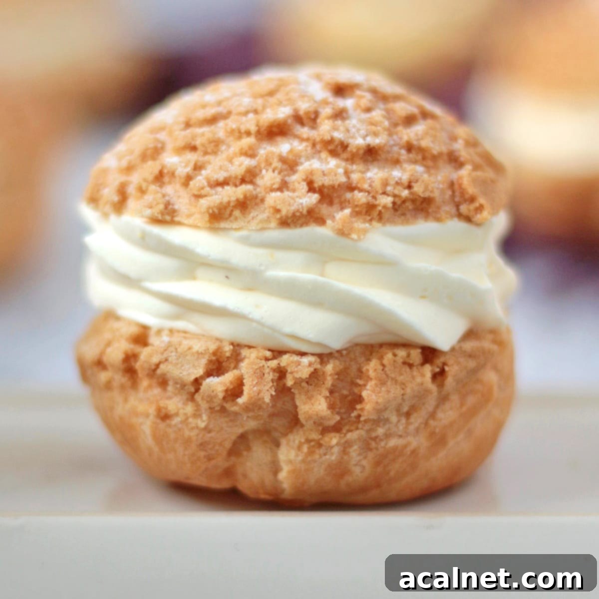 Three Choux à la Creme on a white board