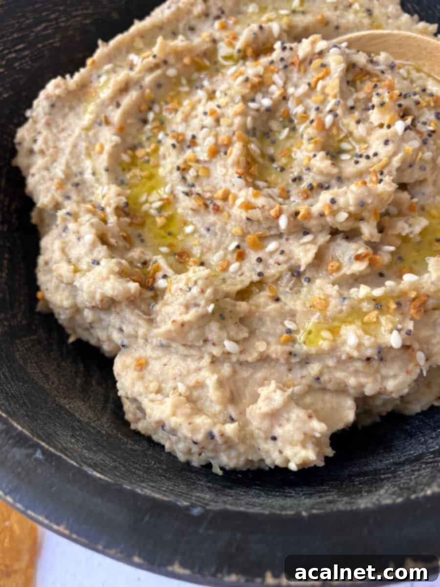 Everything-Spiced Cauliflower Hummus 10 Everything Bagel Cauliflower Hummus presented in a stylish bowl, ready to be served.