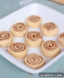 Unbaked rolls in a white ceramic dish