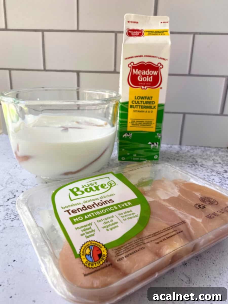 Golden Buttermilk Chicken Tenders 6 A package of chicken tenders with a glass bowl in the background filled with buttermilk