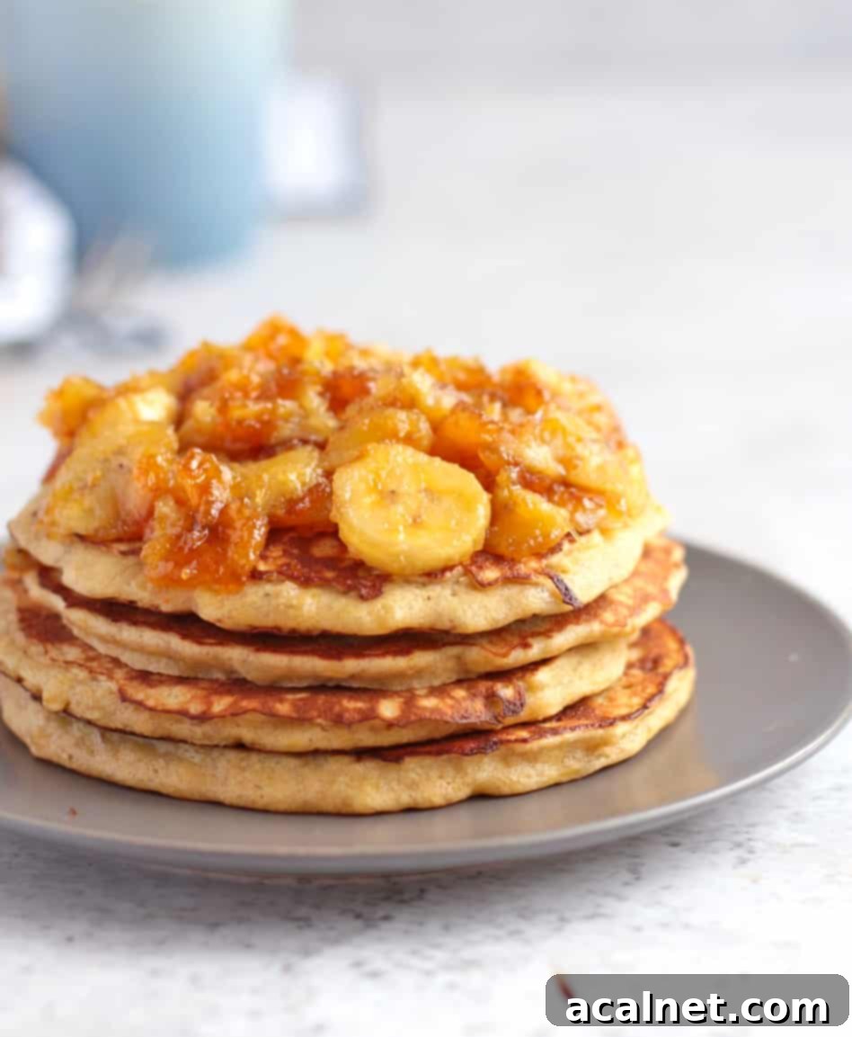 Close up on the side of the pancakes topped with the caramelised banana topping.
