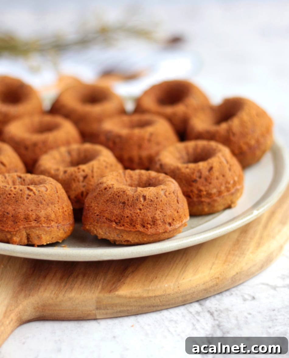Close up on the vegan sticky toffee puddings on a plate.
