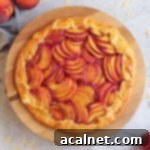 Almond Peach Galette from above on a wooden stand