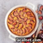 Simple Plum Clafoutis 8 Plum Clafoutis from above in a white ceramic dish