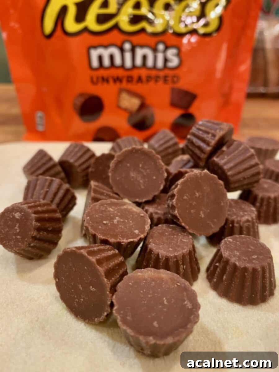 A small mound of mini Reese's minis with the package in the background