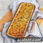 Leek tart in the tart tin on a board