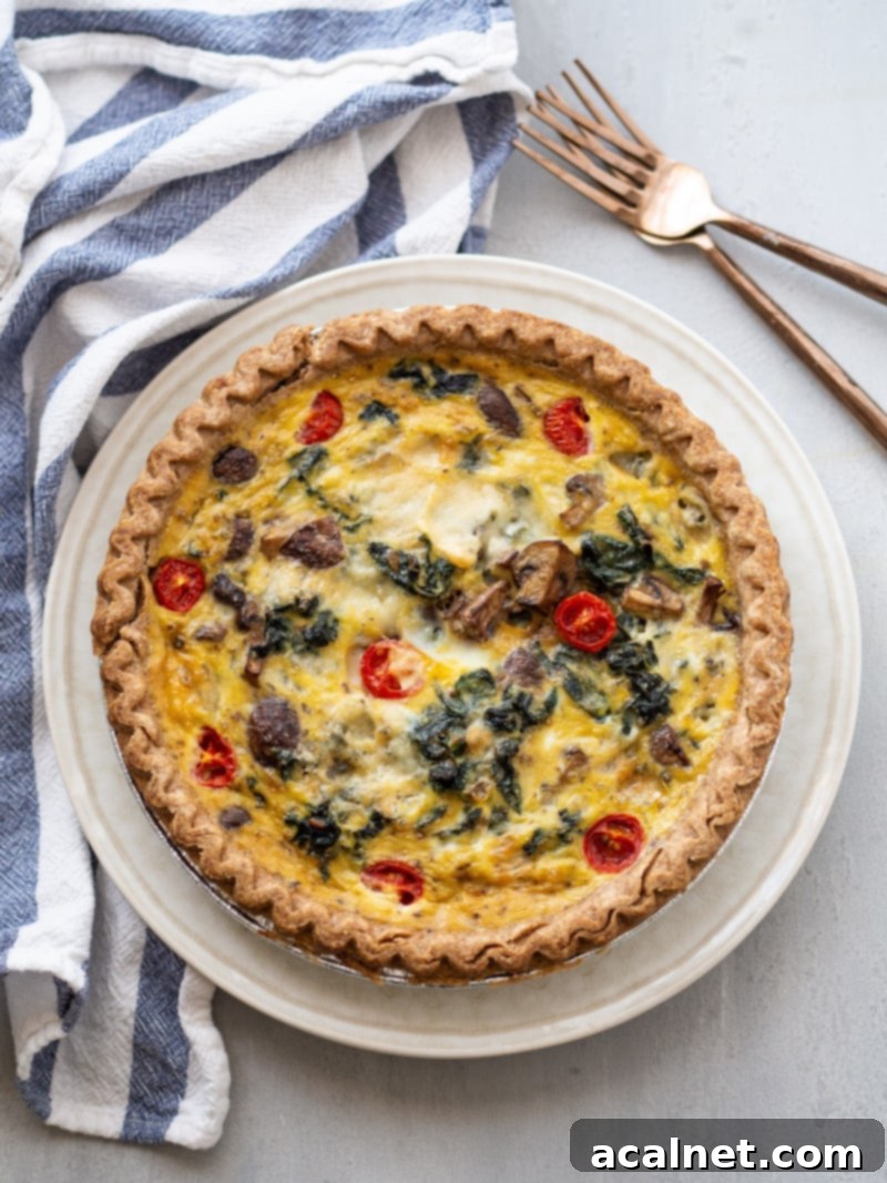 Kale Mushroom and Blue Cheese Quiche, with a creamy bechamel-style sauce and golden crust.