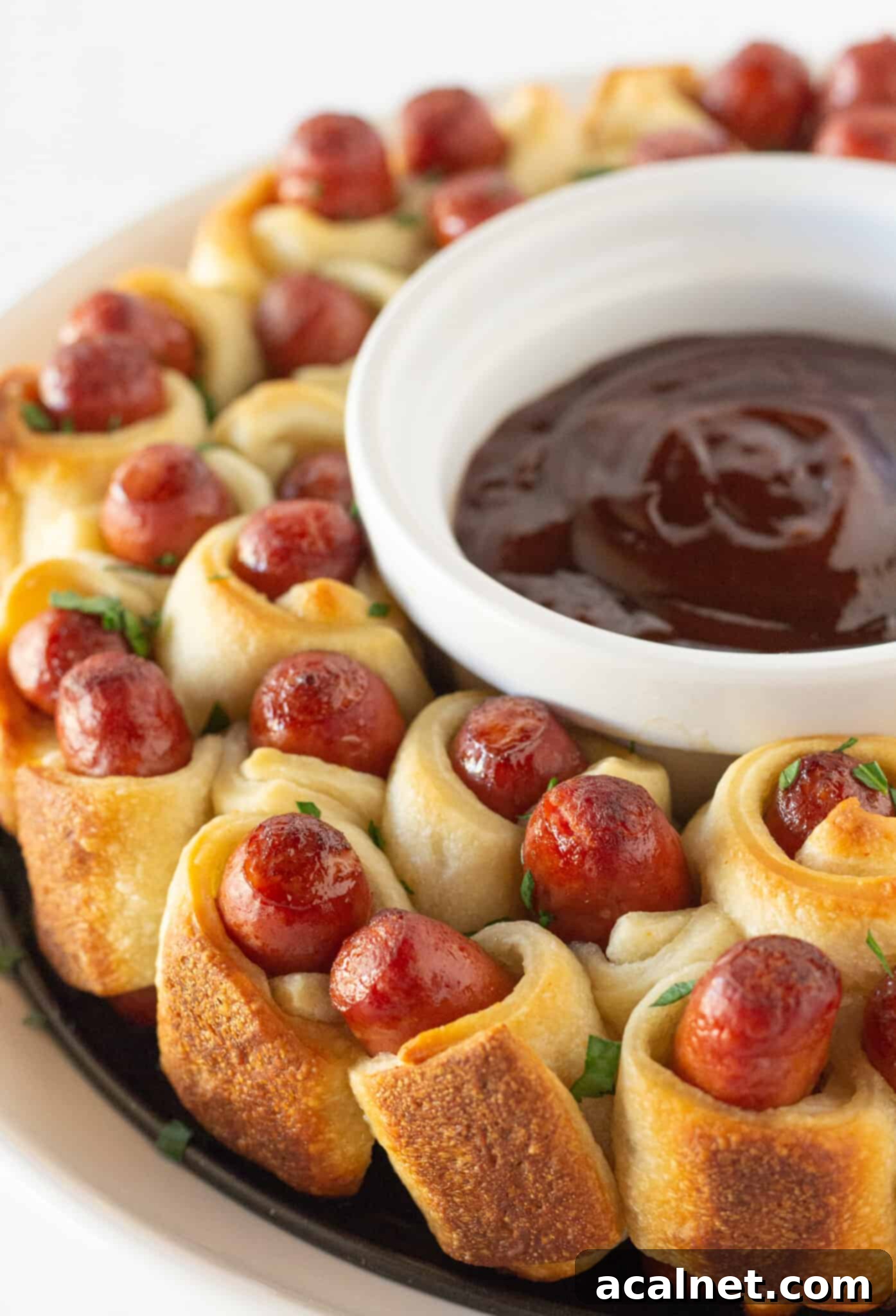 Pull Apart Little Smokies Pigs in a Blanket wreath on a platter.