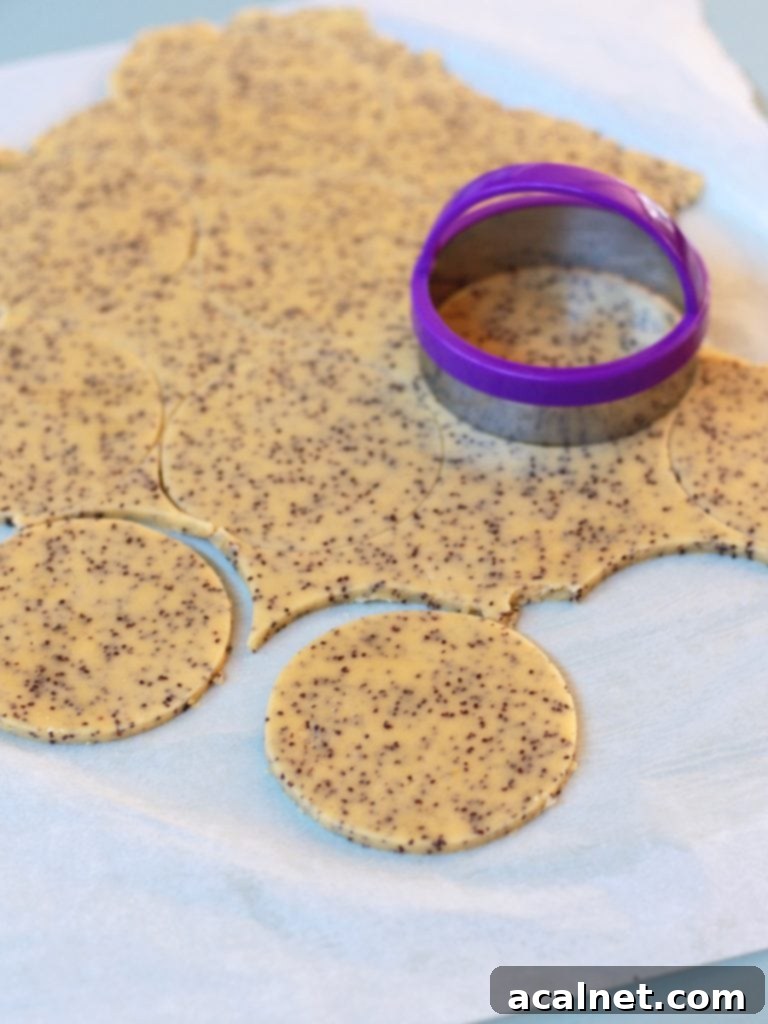 Shaping the cookies with a cookie cutter