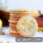 One cookie leaning on a stack of shortbread