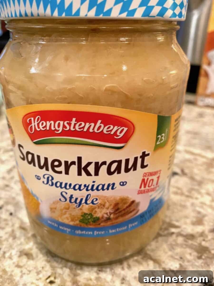 A jar of sauerkraut on a clean kitchen counter, ready for use.