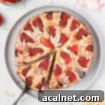 Almond Strawberry Bliss Cake Gluten Free 10 Strawberry almond cake seen from above with a slice cut off.