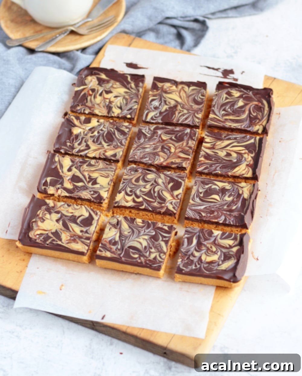 Effortless Peanut Butter Crunch Bars 3 Close-up of freshly sliced no-bake peanut butter chocolate bars, showcasing the distinct layers and inviting texture.