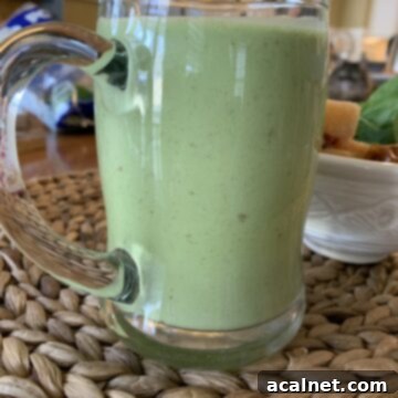 Smoothie in a large glass cup.