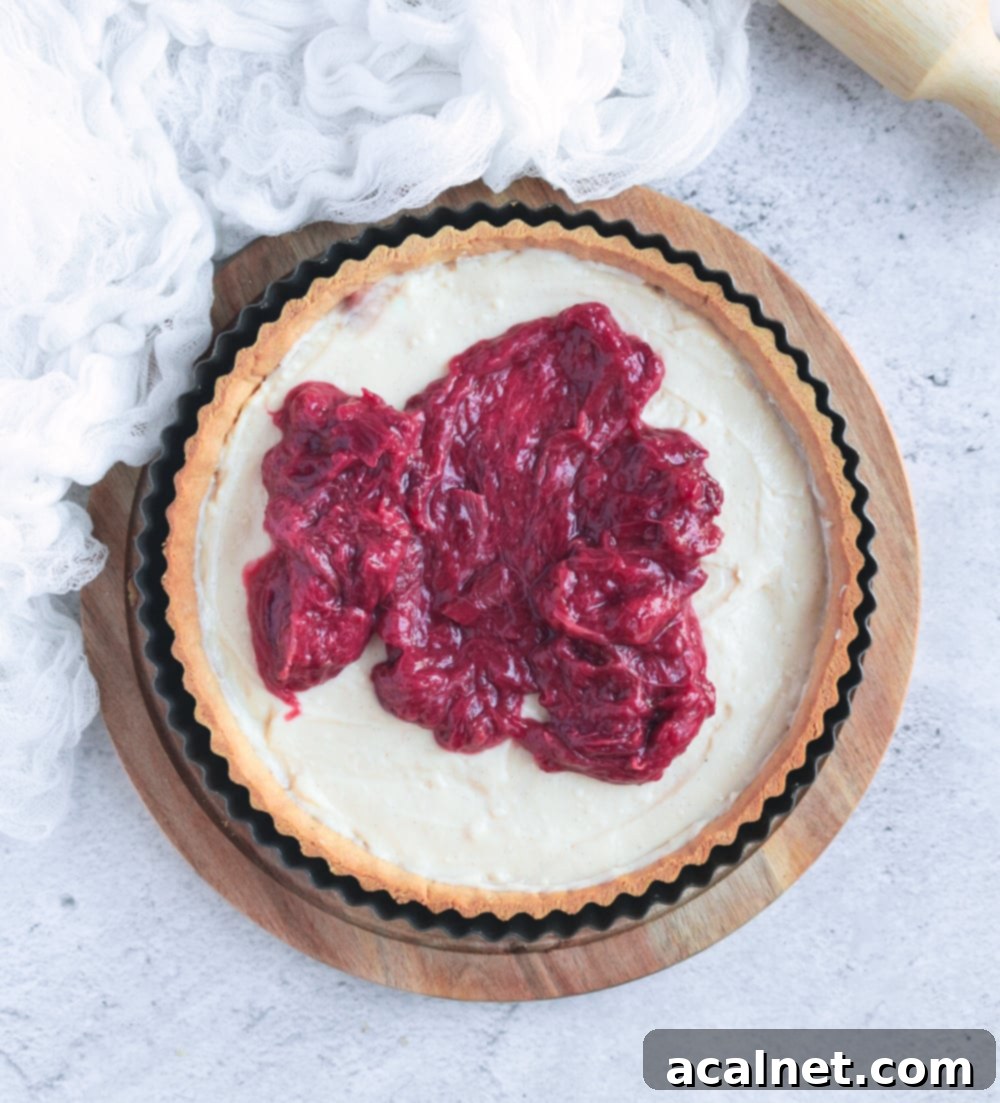 Placing the rhubarb compote over the pastry cream