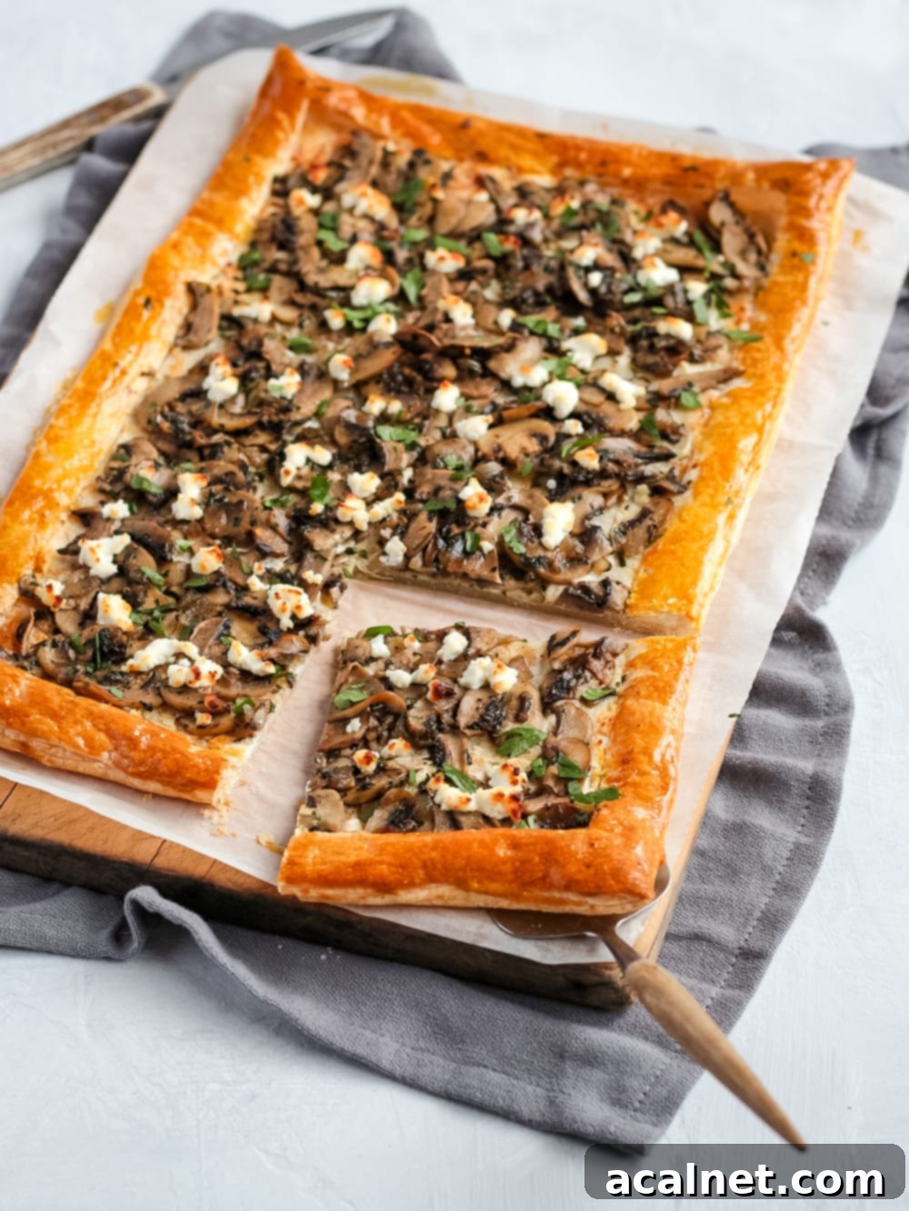 Close up on a slice of tart on a wooden board