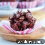 One chocolate cornflake cake unwrapped over a small wooden plate
