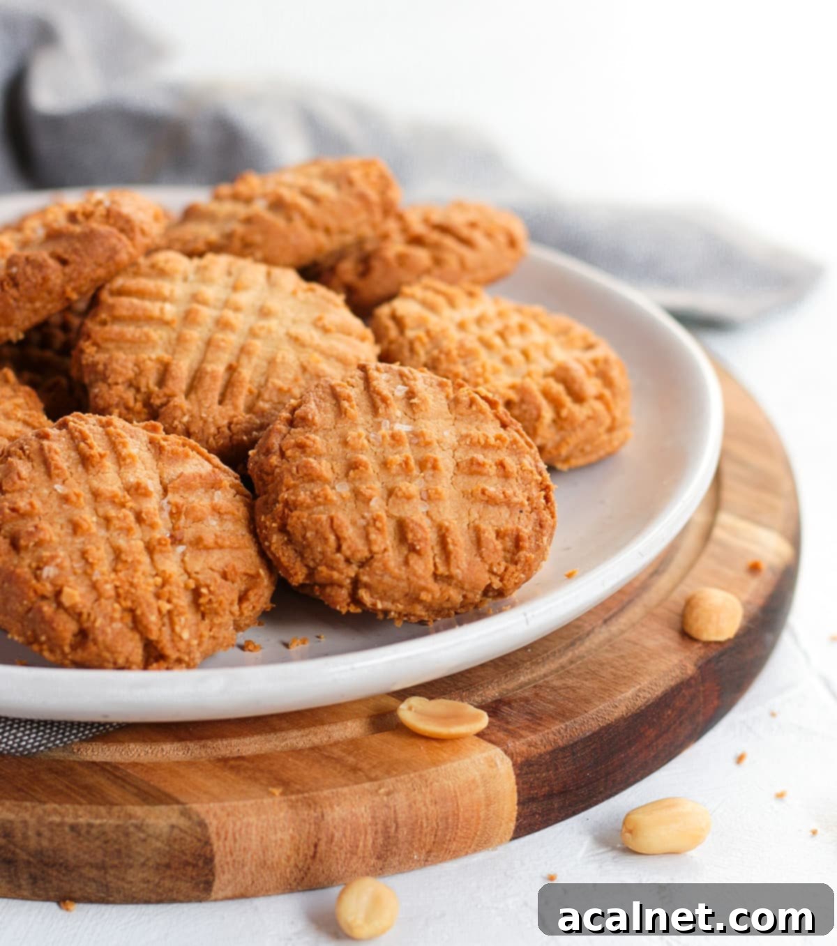Cookies on a white plate over a wooden board.