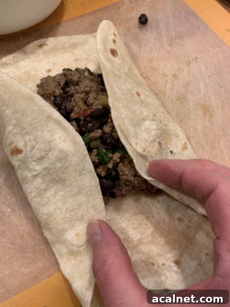 Flour tortilla containing beef filling. 
