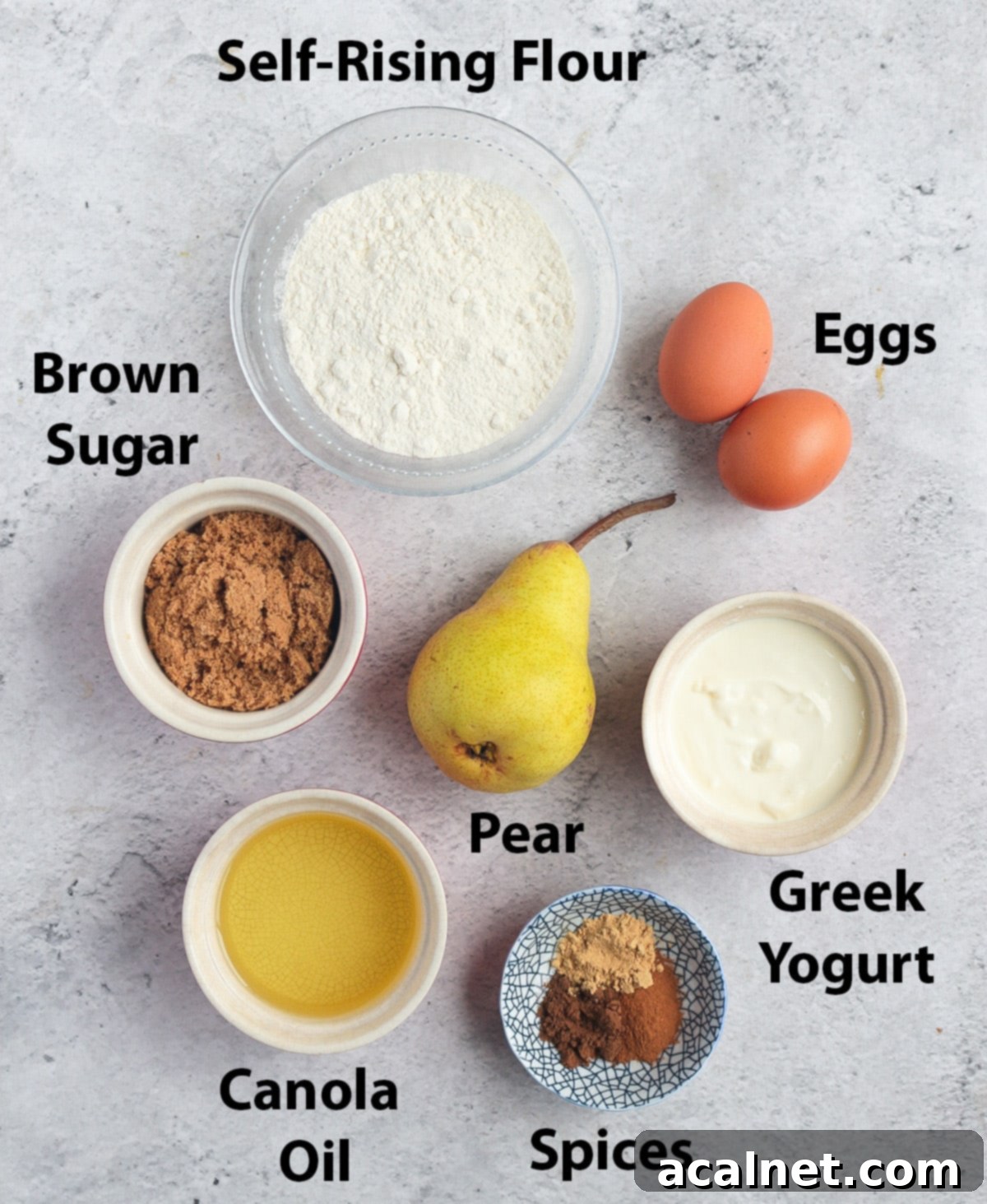 Warm Spiced Pear Muffins 3 A flat lay shot of all the dry and wet ingredients for pear muffins, neatly arranged on a white background.