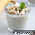 Banana Chia Seed Pudding in a small glass cup topped with coconut, bananas and mint