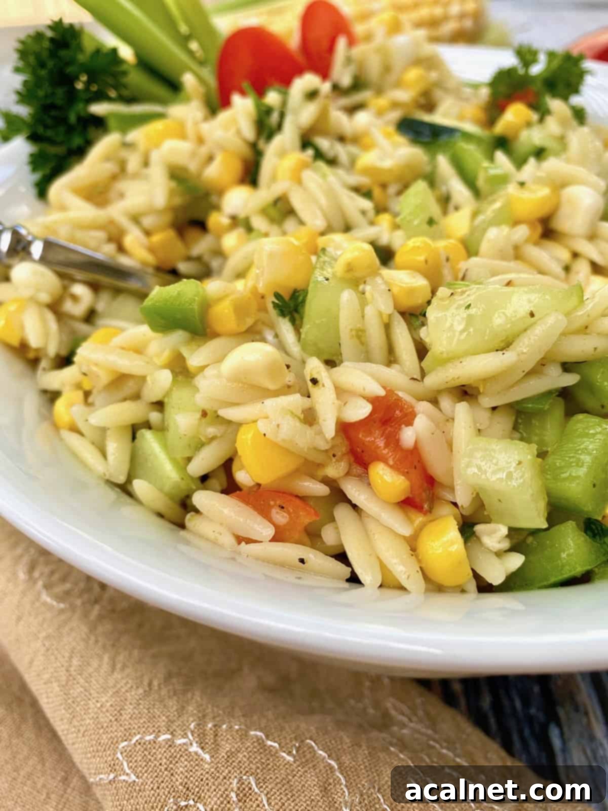 A bowl of sweet corn pasta salad.