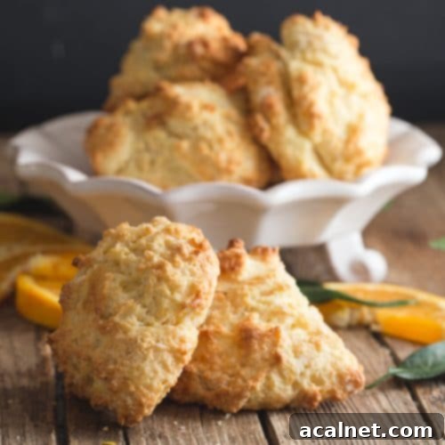 A pile of Quick Orange Drop Biscuits, soft and golden, with a hint of citrus glaze.